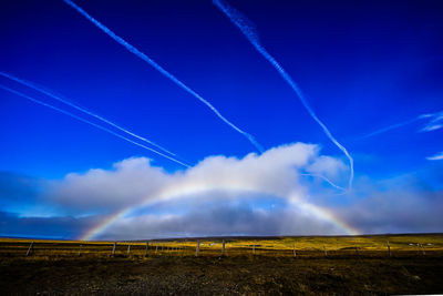 Low angle view of vapor trails in sky