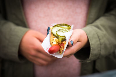 Midsection of woman having food