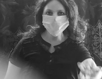 Portrait of woman standing at home