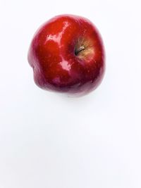 High angle view of apple against white background