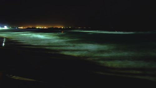 Scenic view of sea against sky at night