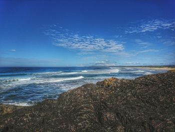 Scenic view of sea against blue sky