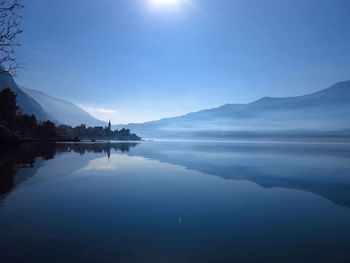 Scenic view of lake against clear blue sky