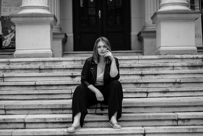 Portrait of woman sitting on steps