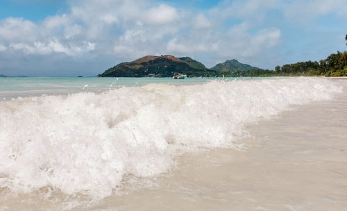 Scenic view of beach against sky