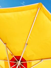 Low angle view of yellow umbrella