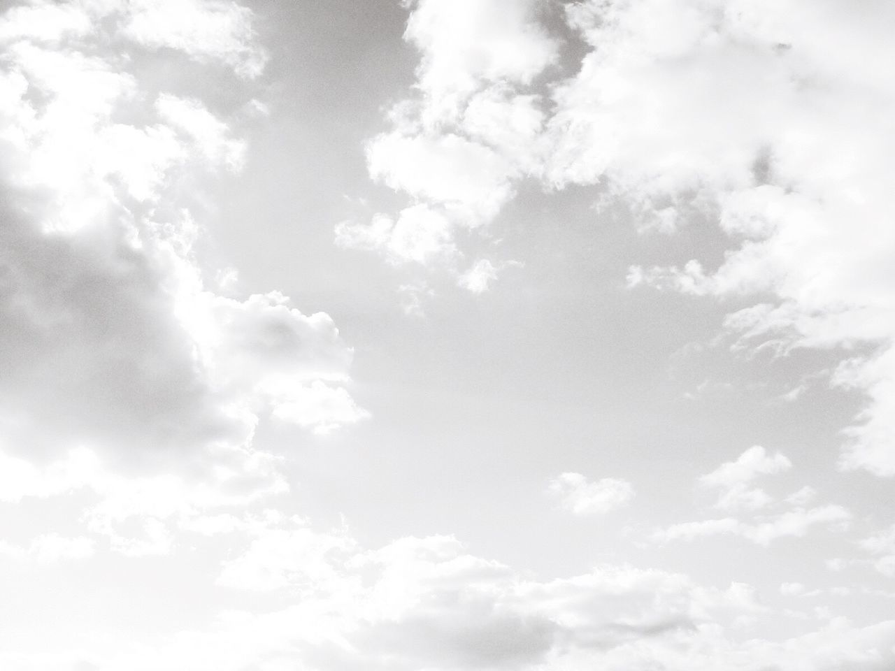 sky, low angle view, beauty in nature, cloud - sky, sky only, tranquility, backgrounds, nature, white color, scenics, full frame, cloudy, tranquil scene, cloudscape, cloud, white, day, blue, idyllic, outdoors