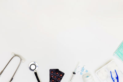 High angle view of objects on table against white background