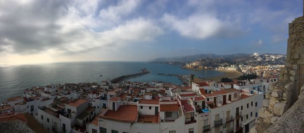 High angle view of city against cloudy sky