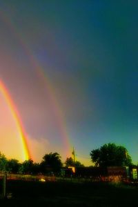 Scenic view of rainbow over field