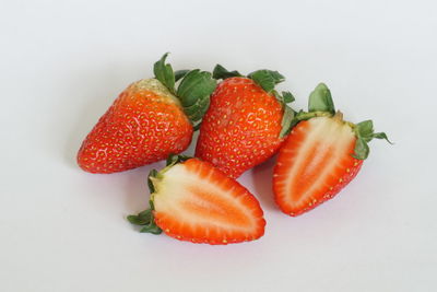 Close-up of strawberries against white background