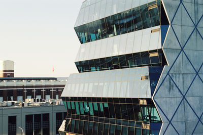 Low angle view of modern buildings against clear sky