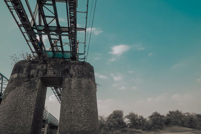 Low angle view of tower bridge against sky