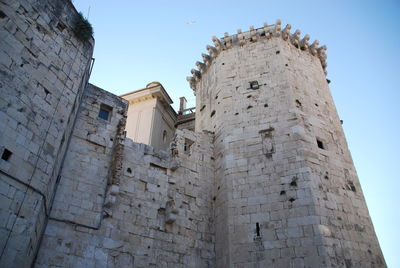 Low angle view of historic building against sky