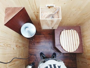 High angle view of table and people on hardwood floor