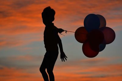 Silhouette of people at sunset