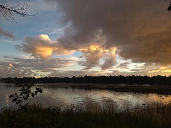 Scenic view of lake against sky during sunset