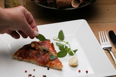 High angle view of person preparing food on table