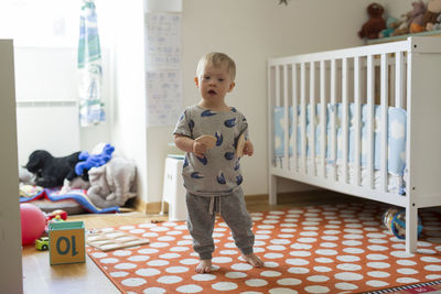 Boy looking at camera barefoot