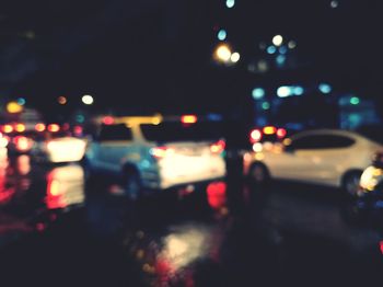 Defocused image of traffic on city street at night