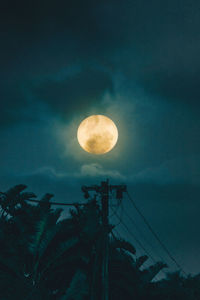 Low angle view of moon in sky at night