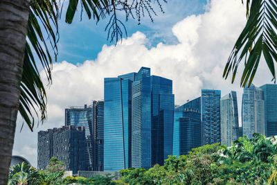 Low angle view of modern buildings against sky in city