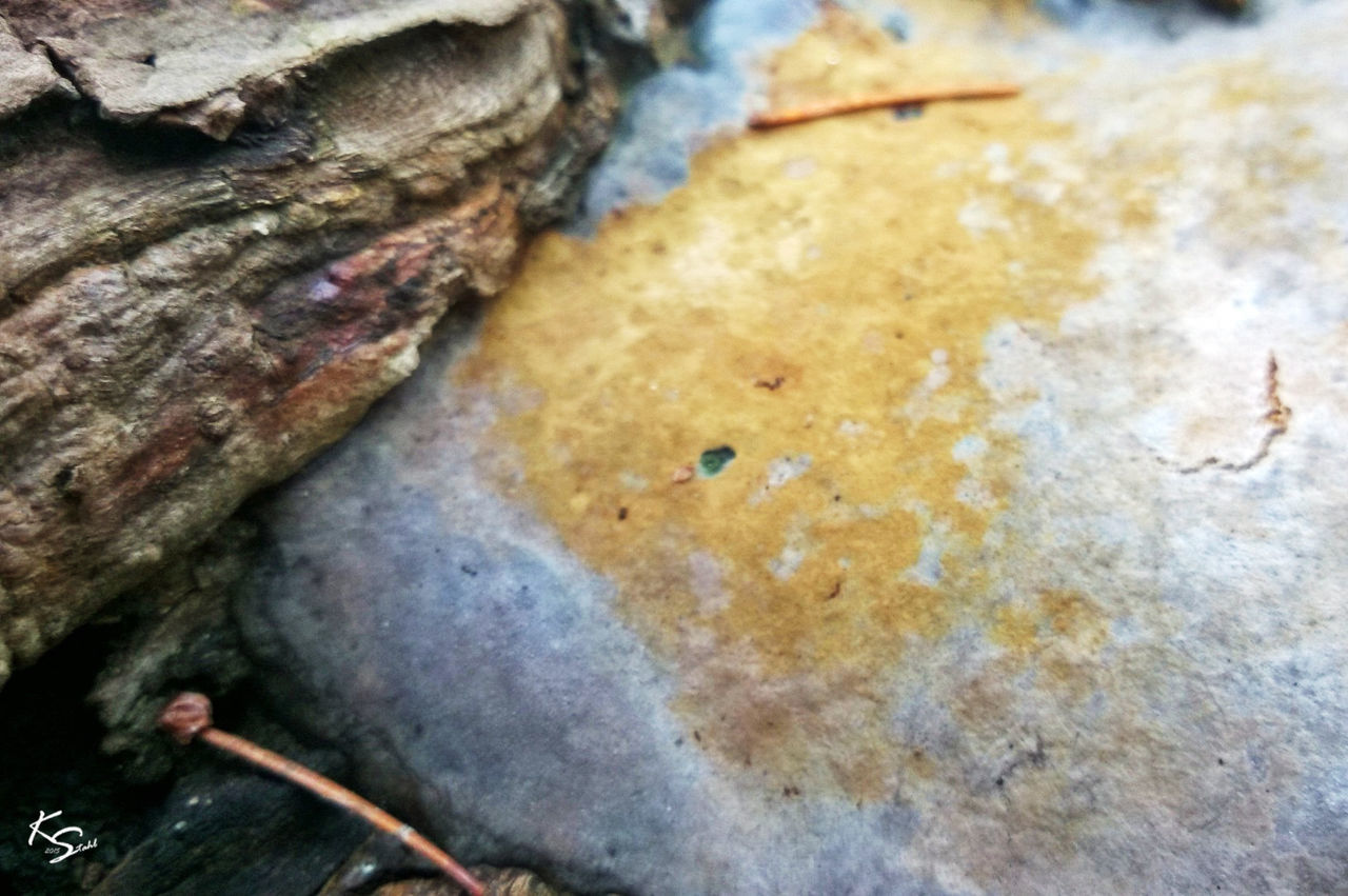 close-up, textured, water, rock - object, rough, nature, high angle view, day, outdoors, no people, full frame, selective focus, rock, backgrounds, wet, focus on foreground, moss, beauty in nature, rock formation, detail