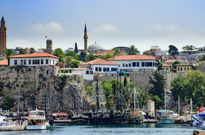 Buildings in front of sea at harbor