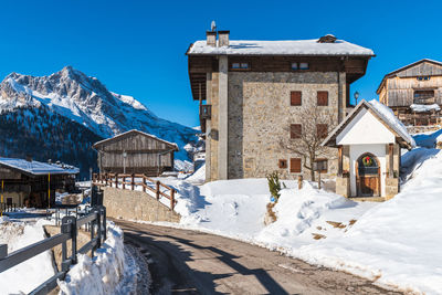 Winter magic. the ancient wooden houses of sauris di sopra. italy