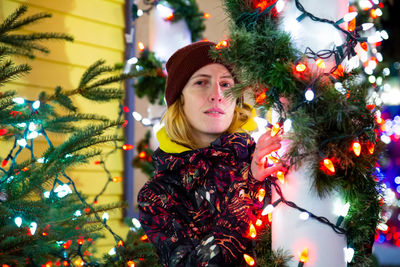 Young woman with christmas tree