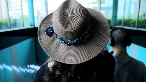 Rear view of woman wearing hat