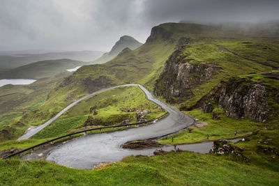 Scenic view of mountain road against sky