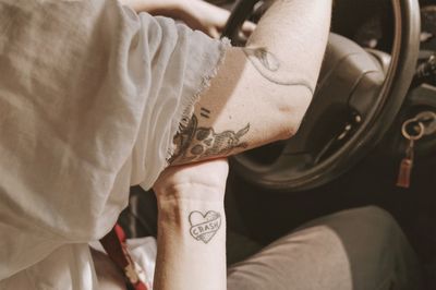 Close-up of man hand in car