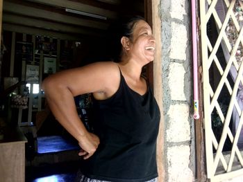 Smiling young woman looking away