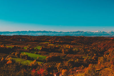 Scenic view of landscape against clear blue sky