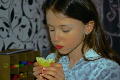 Close-up portrait of a woman drinking drink