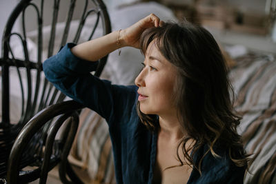 Side view of young woman looking away