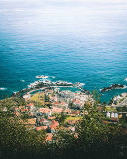 High angle view of town by sea