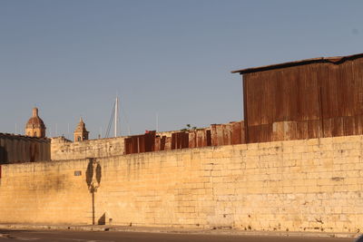 View of buildings against clear sky