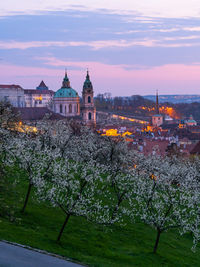 Buildings against sky during sunset in city