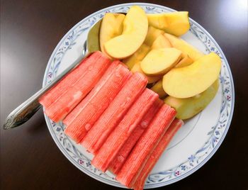 High angle view of fruits in plate on table