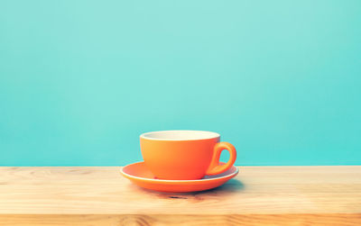 Close-up of coffee cup on table