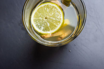 Directly above shot of lemon in glass on table