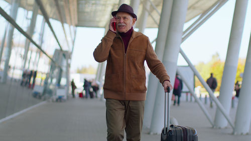 Full length of man standing in bus