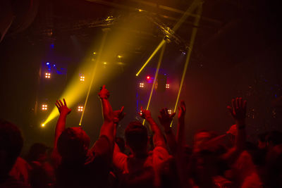 People enjoying music concert at night