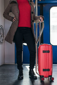 Close up of a woman holding luggage travel bag