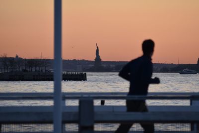 Statue of liberty against sky during sunset