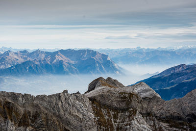 Scenic view of snowcapped mountains against sky