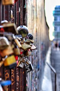 Close-up of padlocks hanging on railing