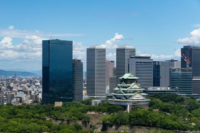 Modern buildings in city against sky